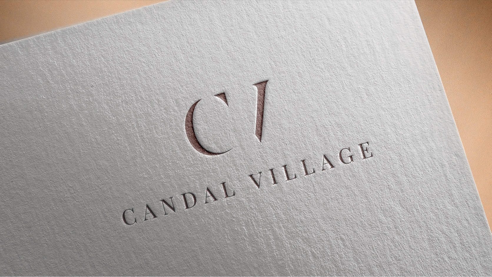 Candal Village logotype embossed on paper